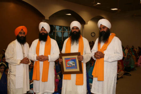 L to R: GSSWH Bhai Sahib, Bhai Sukhdev Singh, Sant Anoop Singh Ji Unawale (with plaque) flanked by his companions